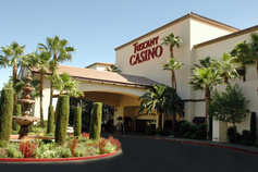 Image of Tuscany Casino Front Entrance with Palm Tree Scenery